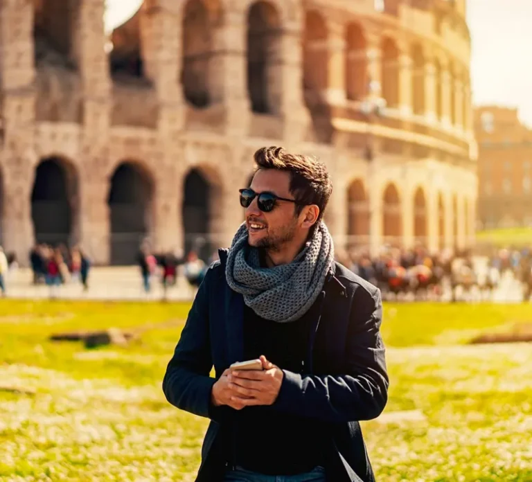tourist guy in park outside colosseum