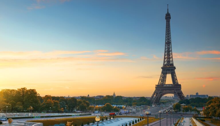 Eiffel Tower and fountains near it at dawn in Paris, France